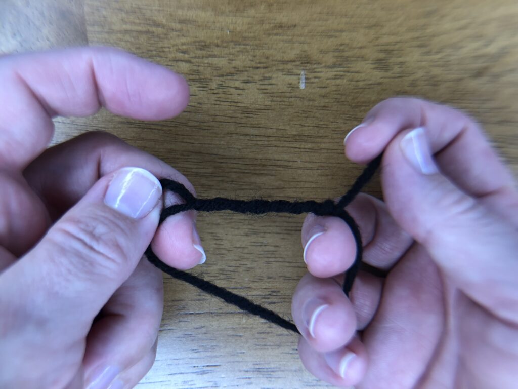 6 loops around black thread to make a knot eye