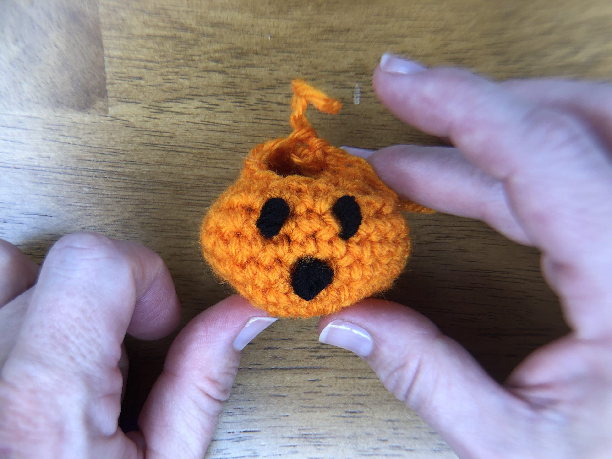 finished face on orange baby pumpkin