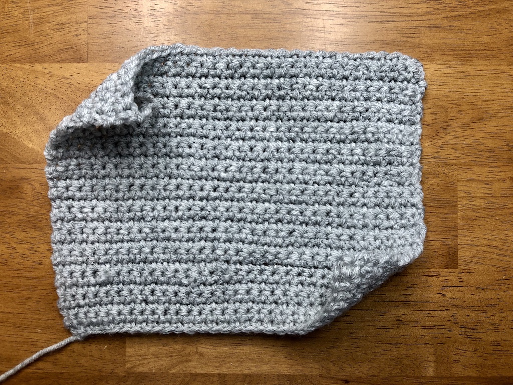 How to make a crochet gauge swatch using a light gray crochet swatch.