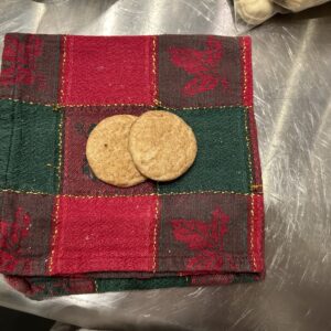 small round chai spiced snickerdoodle cookies on a red and green napkin